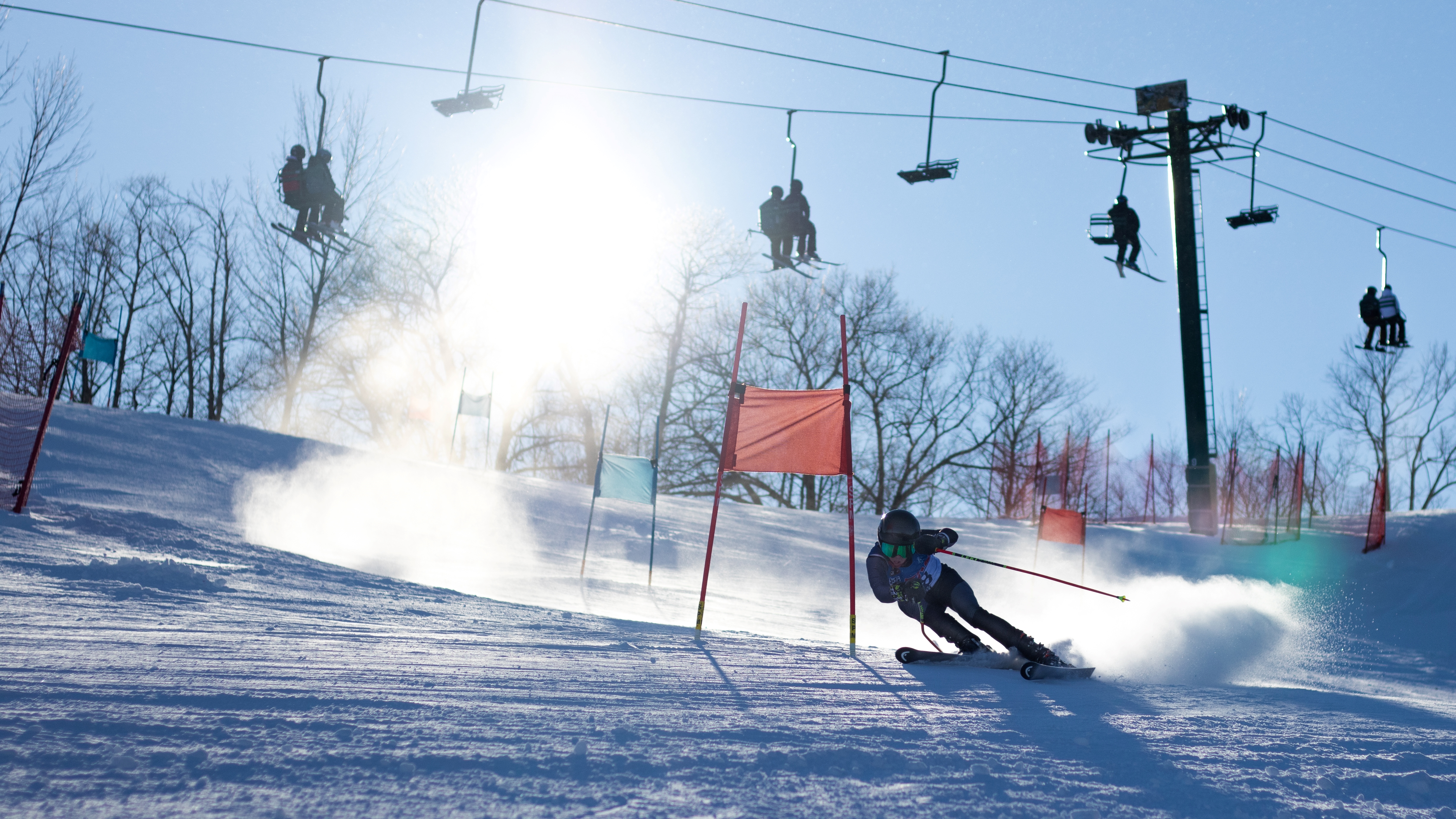 Ski racer passing a gate.