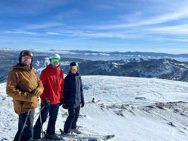 3 skiers on a ridge