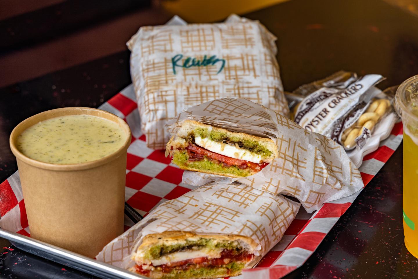 soup and sandwiches on a tray
