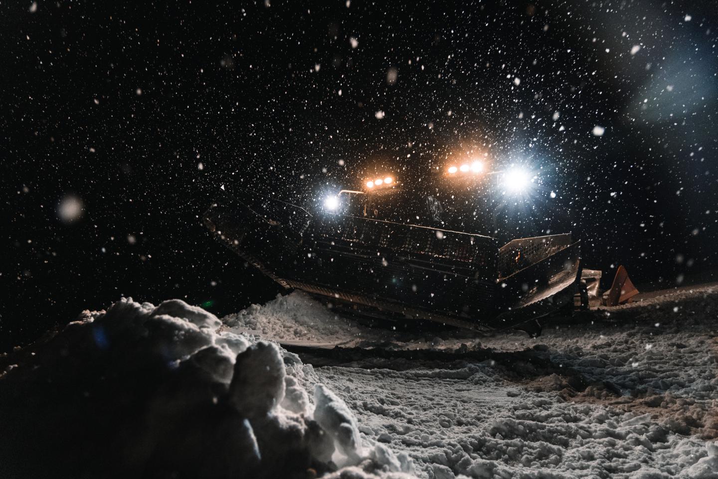 snowcat grooming at night