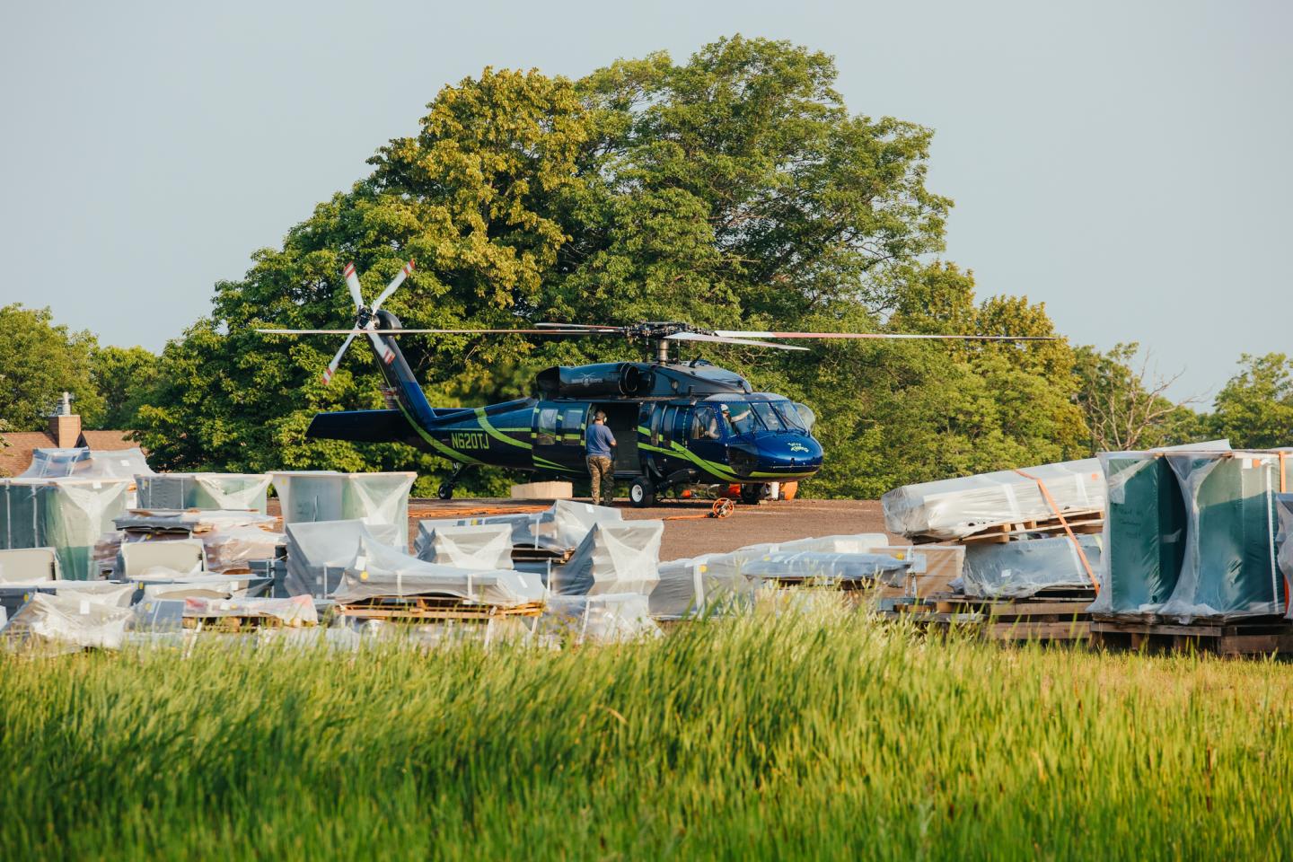 Crew prepares helicopter for flight.