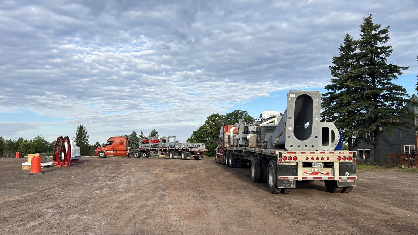 Two trucks wait to be unloaded at Jackson Creek Summit.