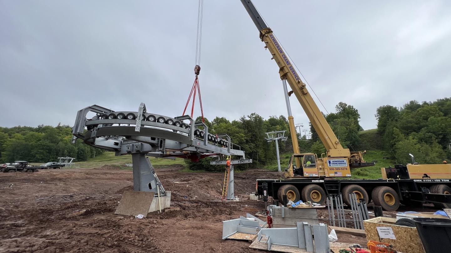 Crane assembles new chairlift terminal.