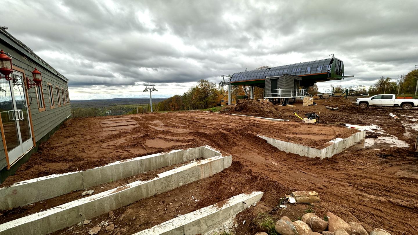 Patio walls poured with freshly placed sand base.