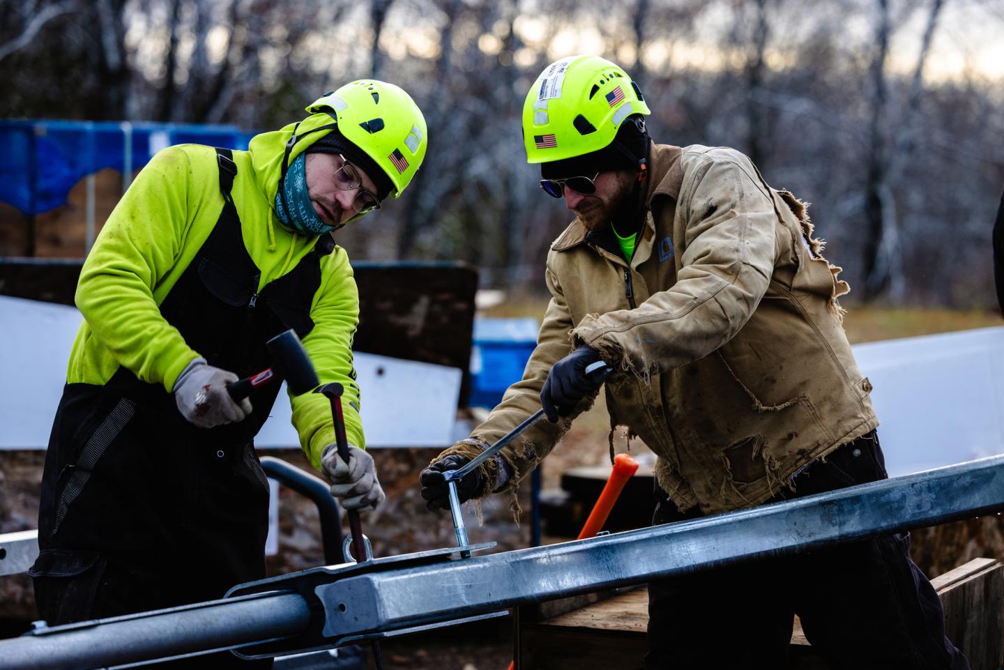 Workers assemble a chair for the new Voyageur Express Lift.