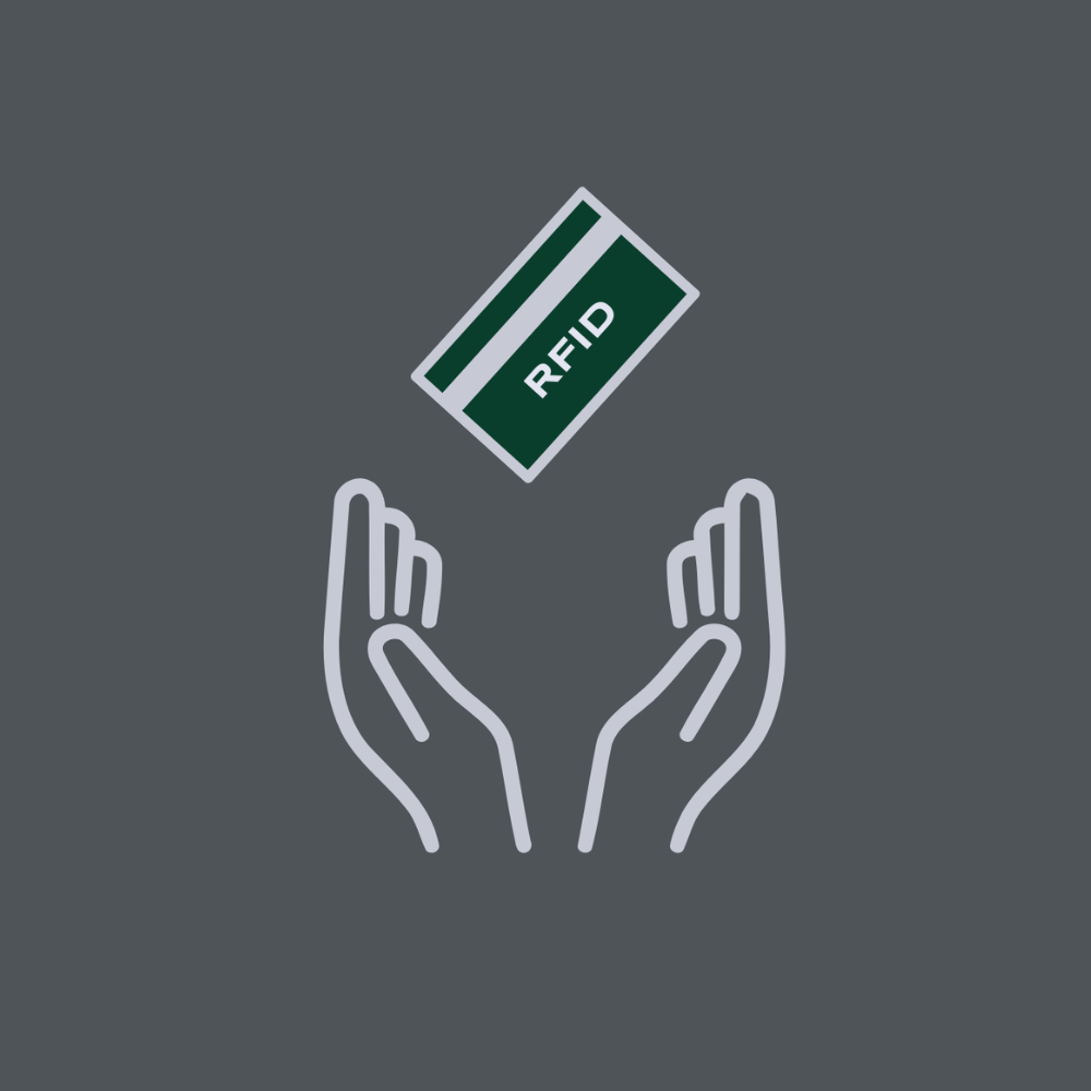 Hands reaching for an RFID card on a dark background.