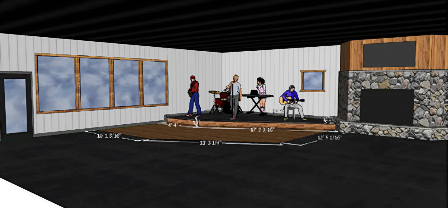 Band playing on an indoor stage with large windows and a stone fireplace.