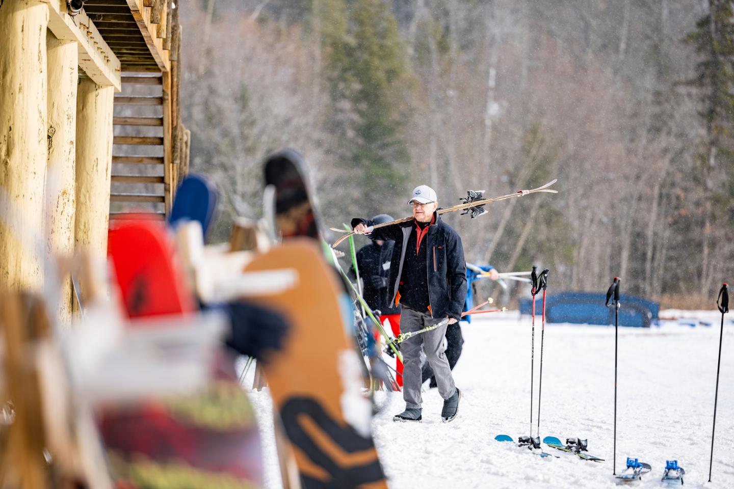 Veteran skier heading towards the chalet to get ready